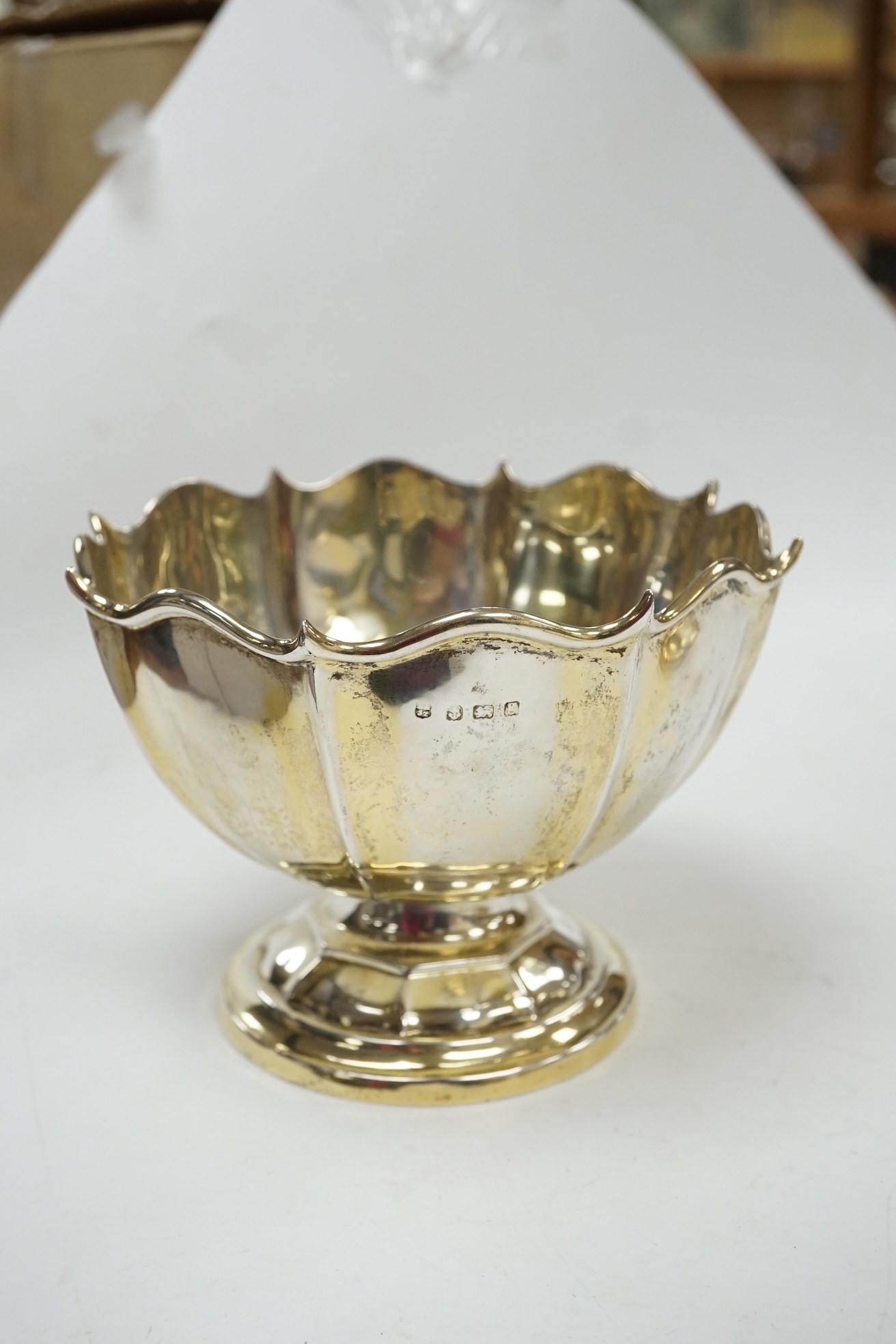 An Edwardian small silver rose bowl, Birmingham, 1906, diameter 14.7cm, together with a later silver waiter and small dish/stand, 13.4oz. Condition - poor to fair